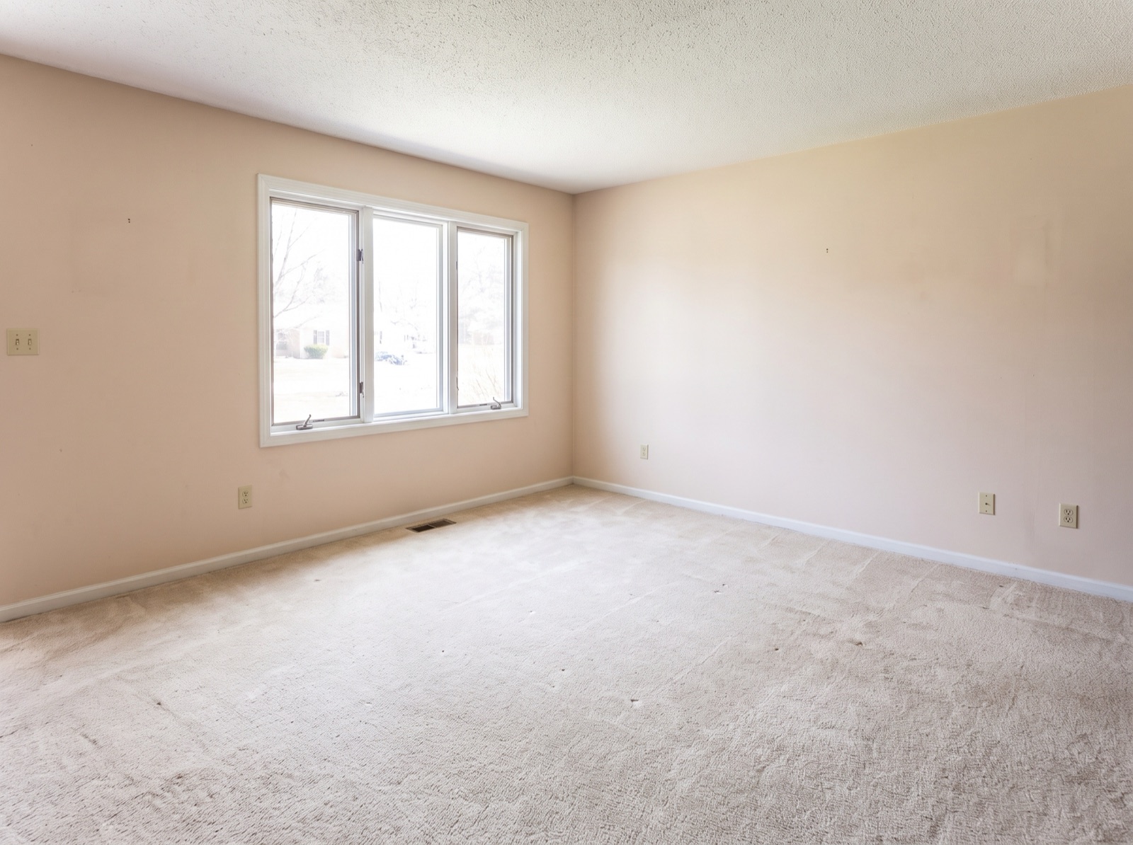 Same living room after AI furniture removal, empty